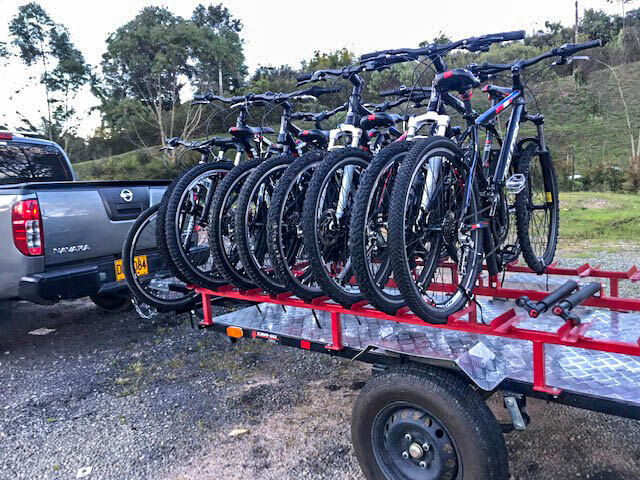 car pulling trailer with bicycles