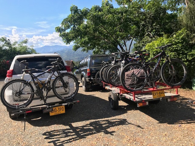 cars pulling trailers with bicycles