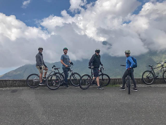 bike riders catching view from the mountains of colombia