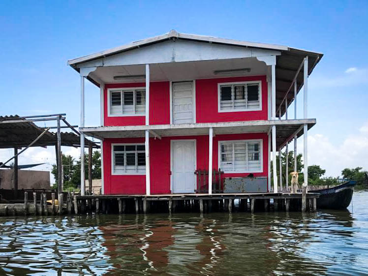 two story house on stilts over water