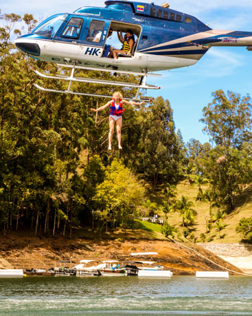 man jumping out of helicopter