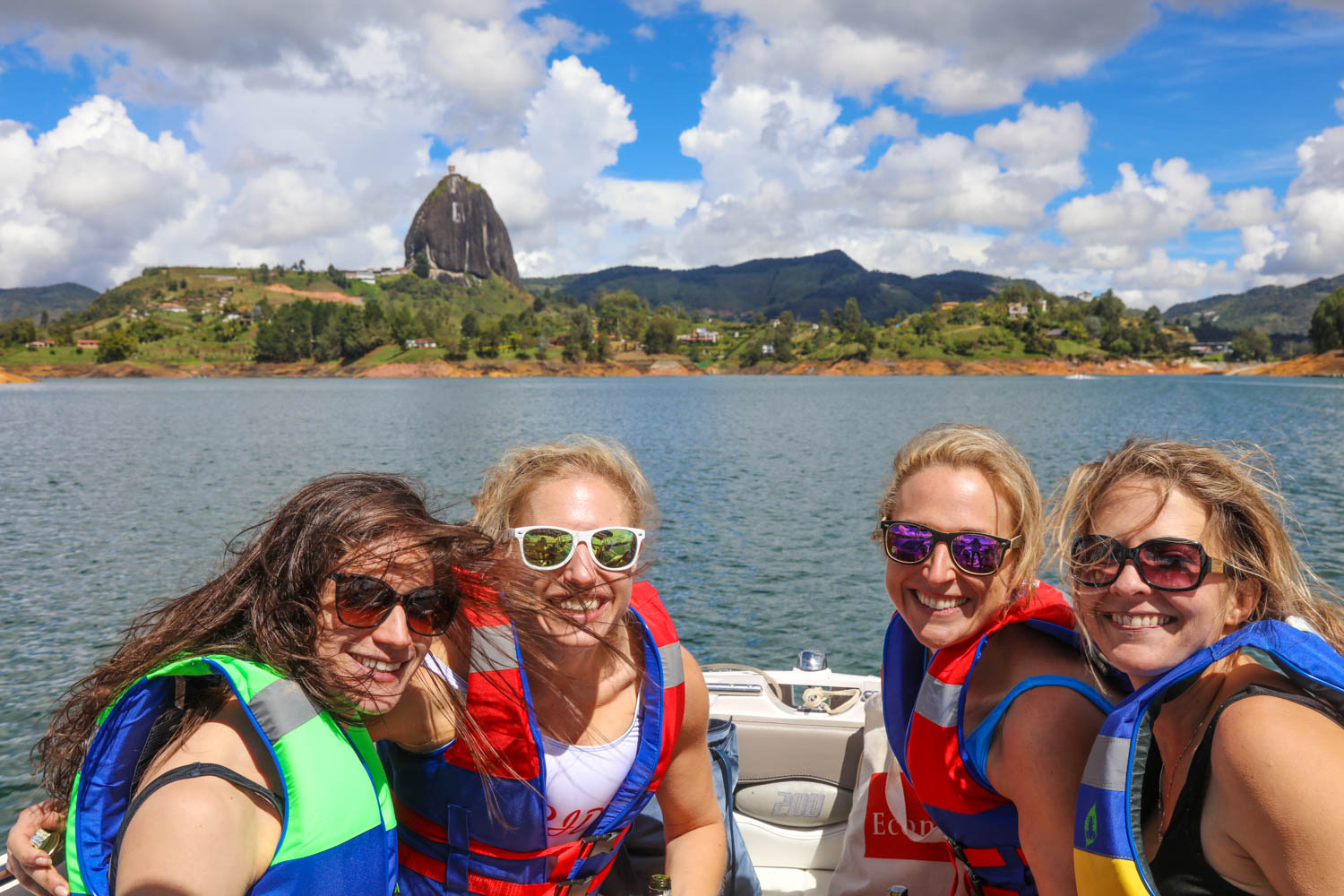 four girls on a boat in lake guatapé