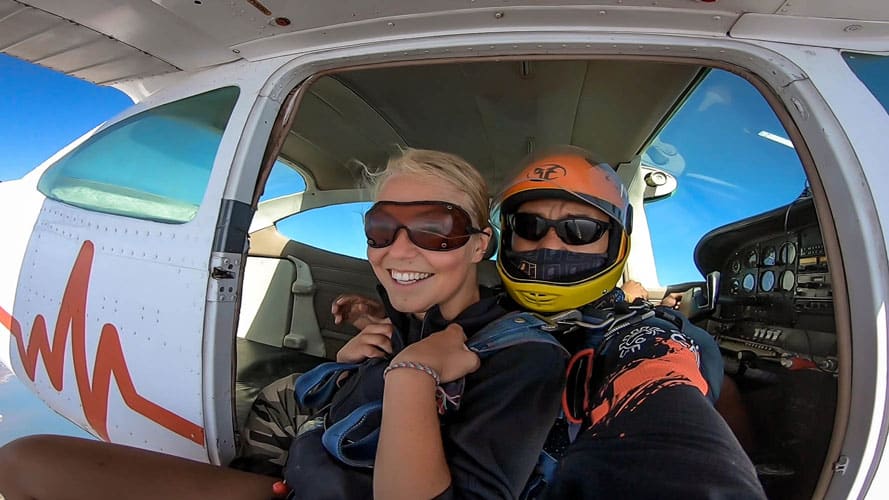 tandem skydivers in plane