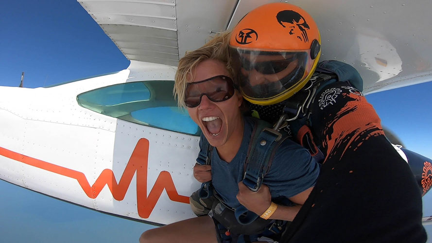 man tandem skydiving