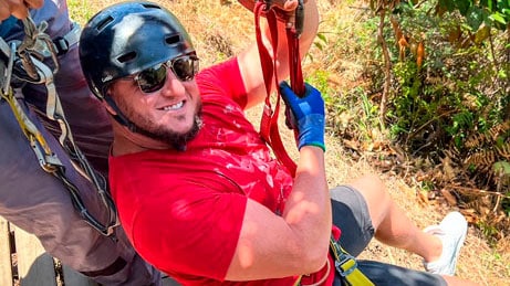 man getting ready to zipline medellin