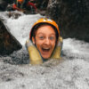 girl with helmet and life vest canyoneering
