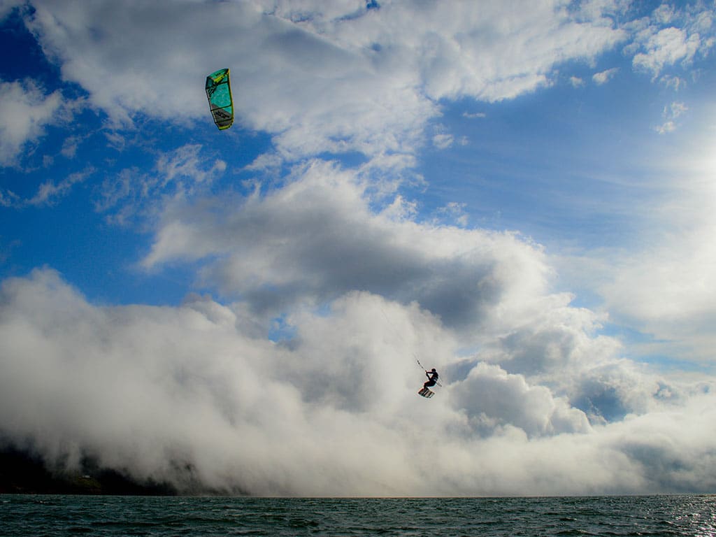 Kitesurfer jumping in Lake Calima, Colombia