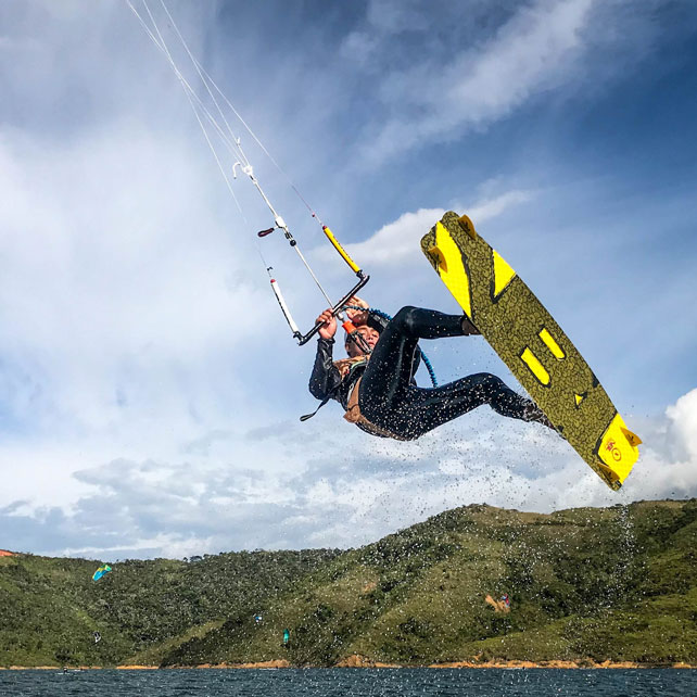 jumping during kitesurfing lake Calima on a kite trip Colombia