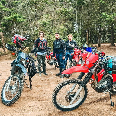 small group of men on motorcycle tour medellin